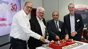 30 Years of the LS telcom USERgroup Conference Representatives of LS telcom and international customers celebrate the 30th anniversary of the LS telcom USERgroup Conference during a cake-cutting ceremony in Lichtenau, Germany.